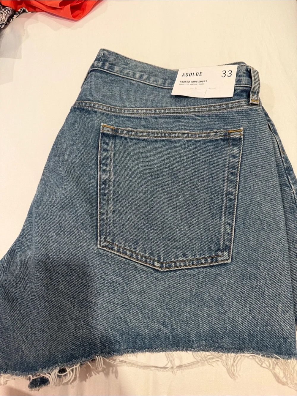 NWT Agolde Parker long denim short size 33